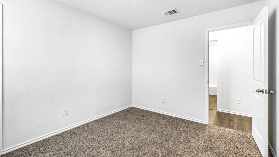 Spacious, unfurnished interior of a new home in Stonewyck Farms, Ennis (Image 22).