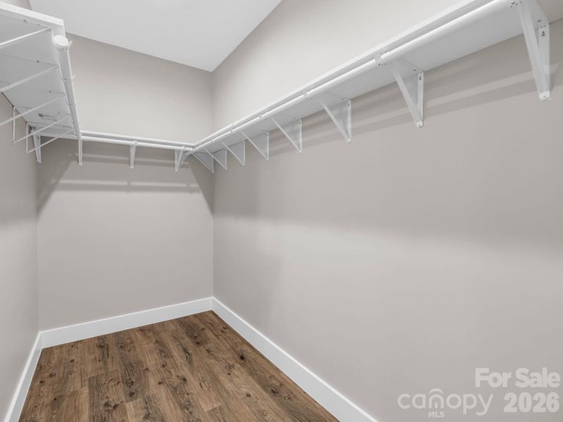 Primary walk-in closet Primary walk-in closet