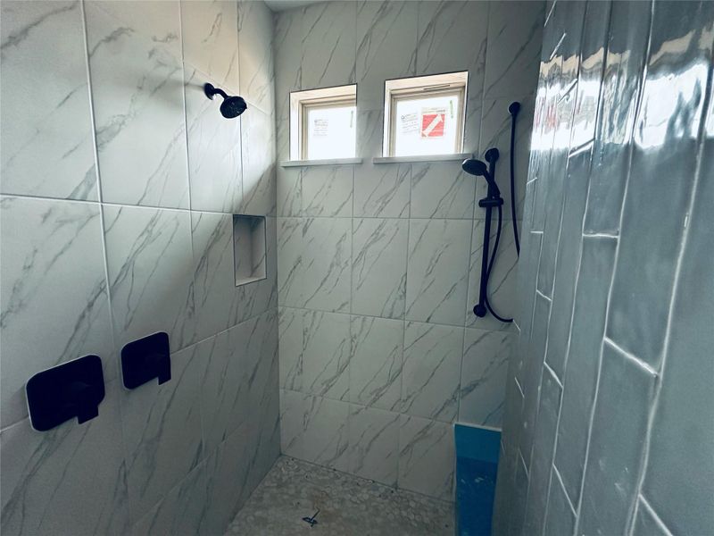 Bathroom featuring tiled shower