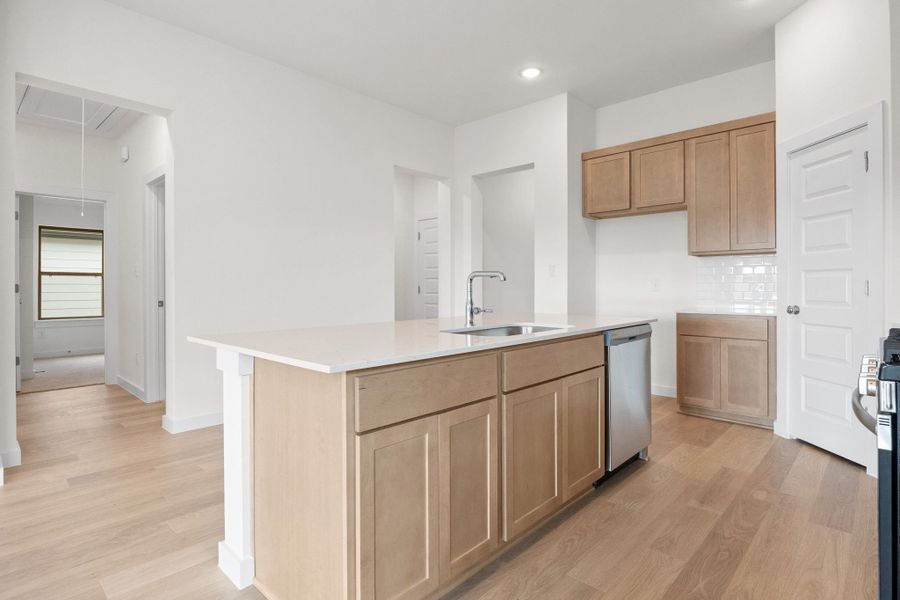 Kitchen in the Turquoise home plan by Trophy Signature Homes – REPRESENTATIVE PHOTO