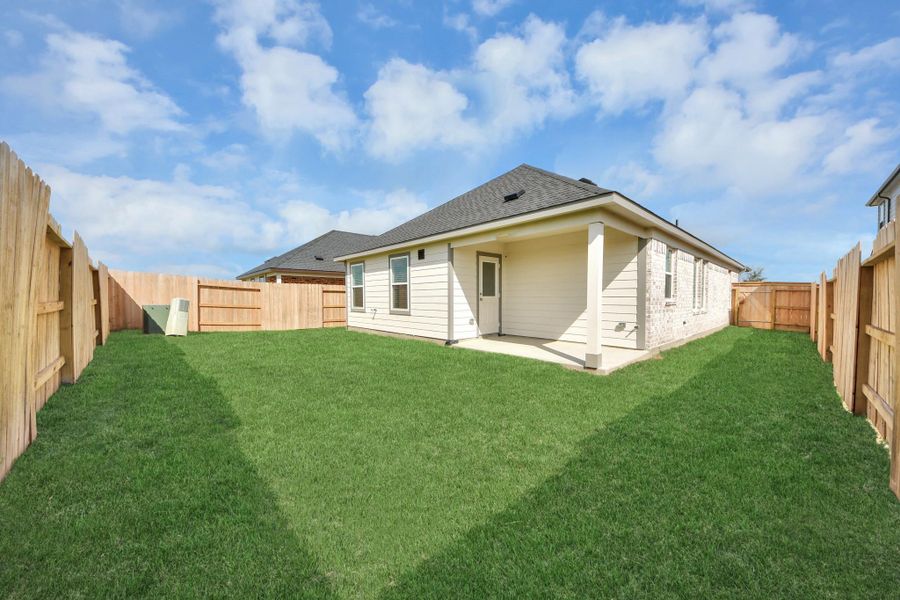 Experience outdoor living at its finest on this expansive covered patio, thoughtfully designed for BBQs and delightful outdoor dining.
