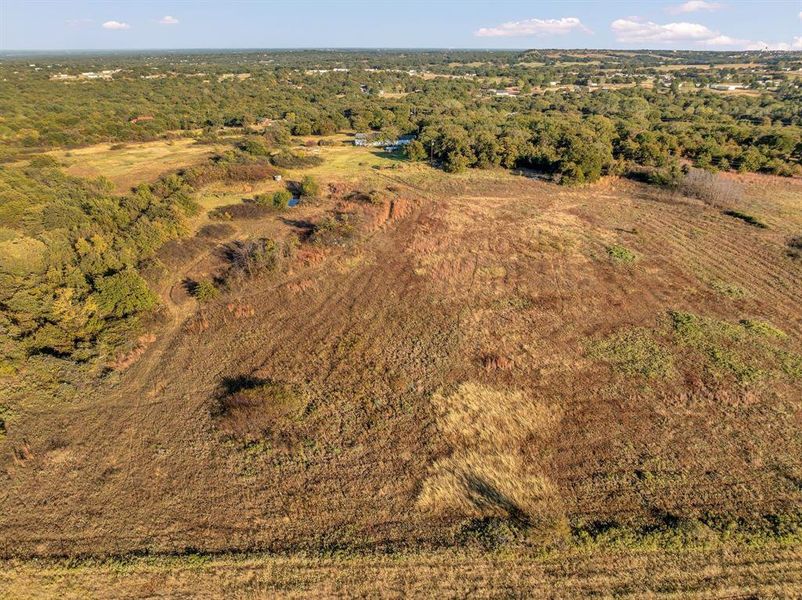 Aerial overview of property's location featuring a forest and rural landscape Aerial overview of property's location featuring a forest and rural landscape