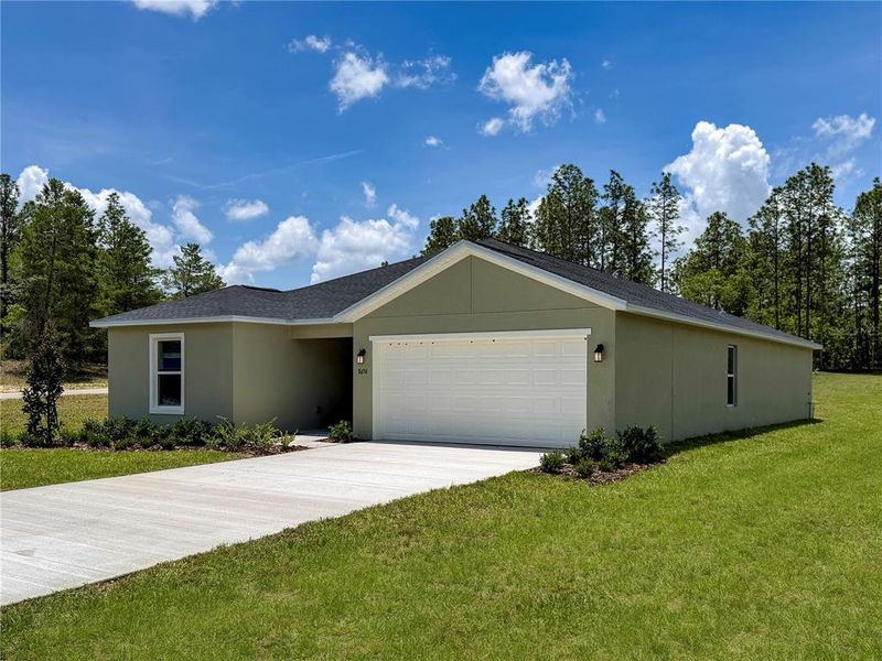 Front exterior of a new home in Marion Ranch, Ocala, FL, highlighting curb appeal (Image 2). Front exterior of a new home in Marion Ranch, Ocala, FL, highlighting curb appeal (Image 2).