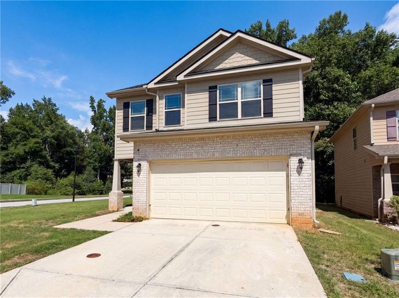 Front exterior of a new home in , Hampton, GA, highlighting curb appeal (Image 17). Front exterior of a new home in , Hampton, GA, highlighting curb appeal (Image 17).