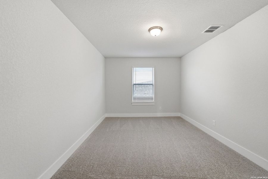 Spacious, unfurnished interior of a new home in The Woodlands at Medina Hills, Mico (Image 22).