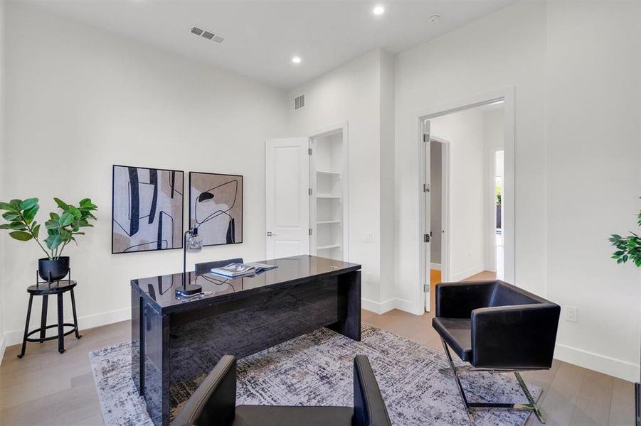 Home office featuring recessed lighting and light wood-style floors
