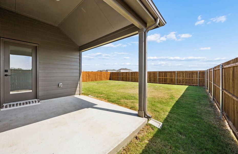 Exterior details and patio area of a home in Ribbonwood, Aubrey (Image 3).