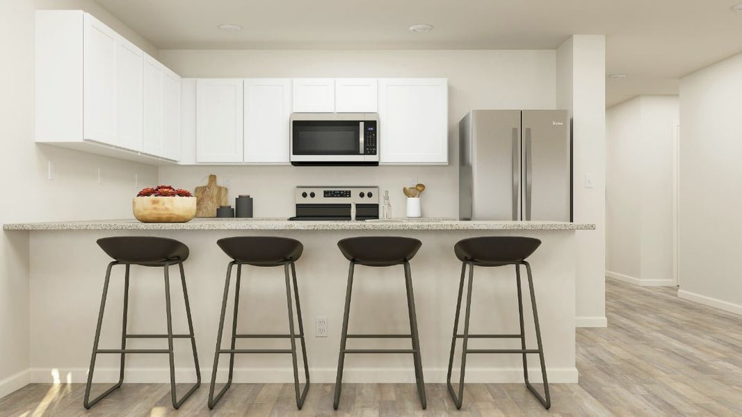 A kitchen with stools and a table. A kitchen with stools and a table.