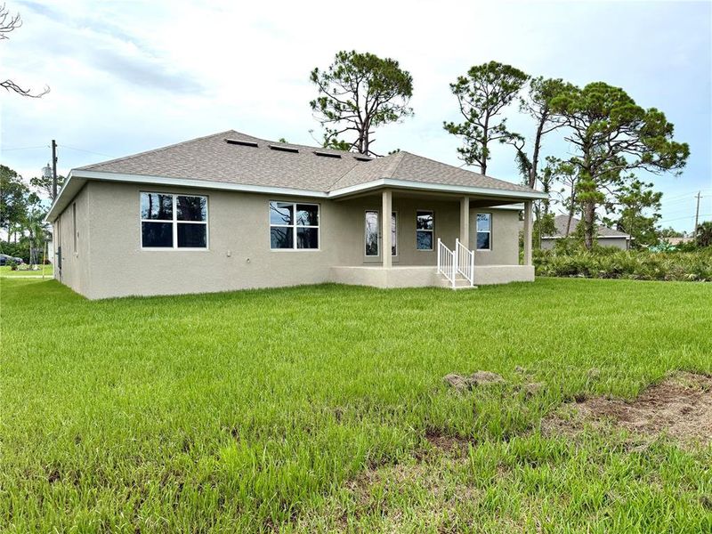 Front exterior of a new home in Rotonda, Rotonda West, FL, highlighting curb appeal (Image 15).
