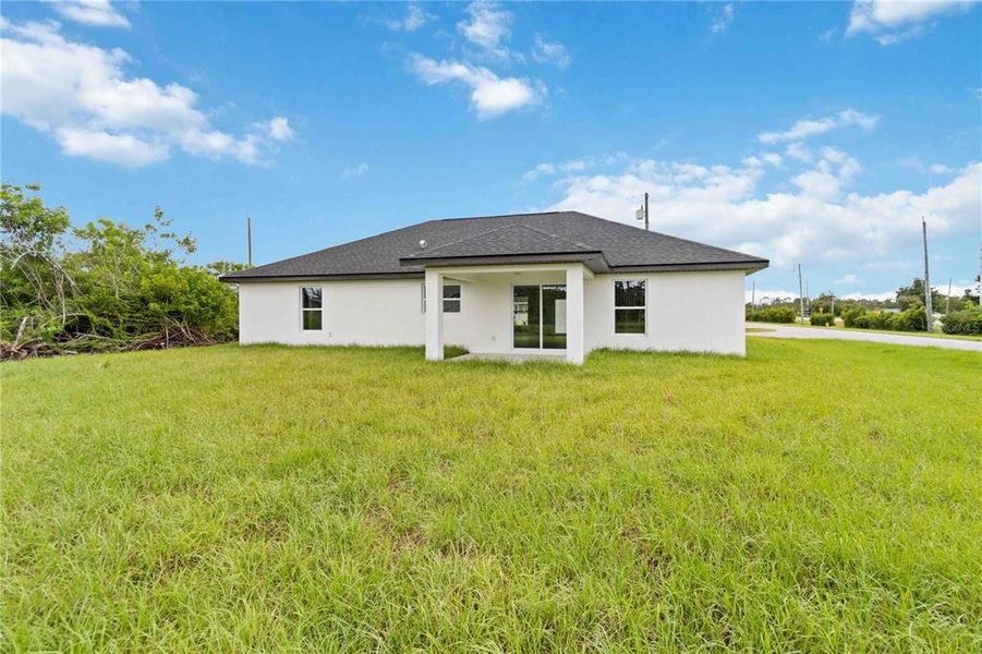 Front exterior of a new home in , Rotonda West, FL, highlighting curb appeal (Image 17).