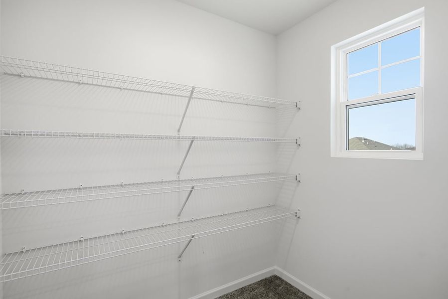 A white wall with a window. A white wall with a window.