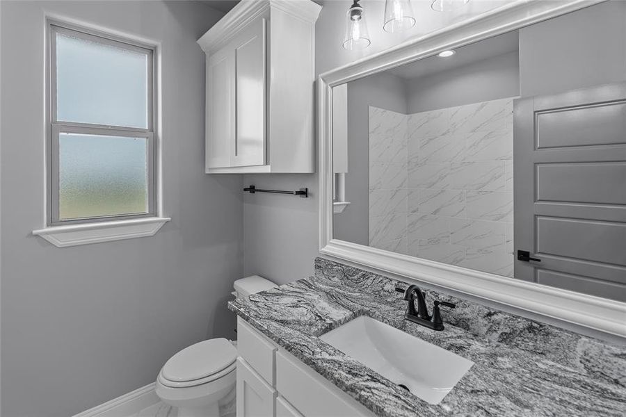 Bathroom featuring toilet and vanity