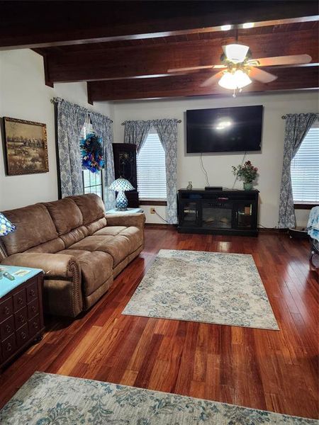 Living room boasts beautiful wood beams and wood floors Living room boasts beautiful wood beams and wood floors