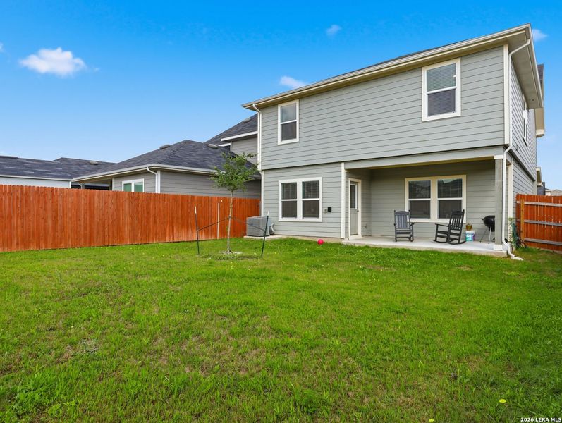 Exterior details and patio area of a home in Watermill, Uhland (Image 3).
