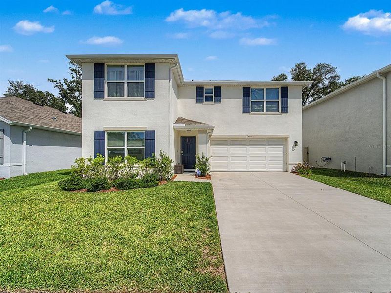 Front exterior of a new home in , Spring Hill, FL, highlighting curb appeal (Image 23). Front exterior of a new home in , Spring Hill, FL, highlighting curb appeal (Image 23).
