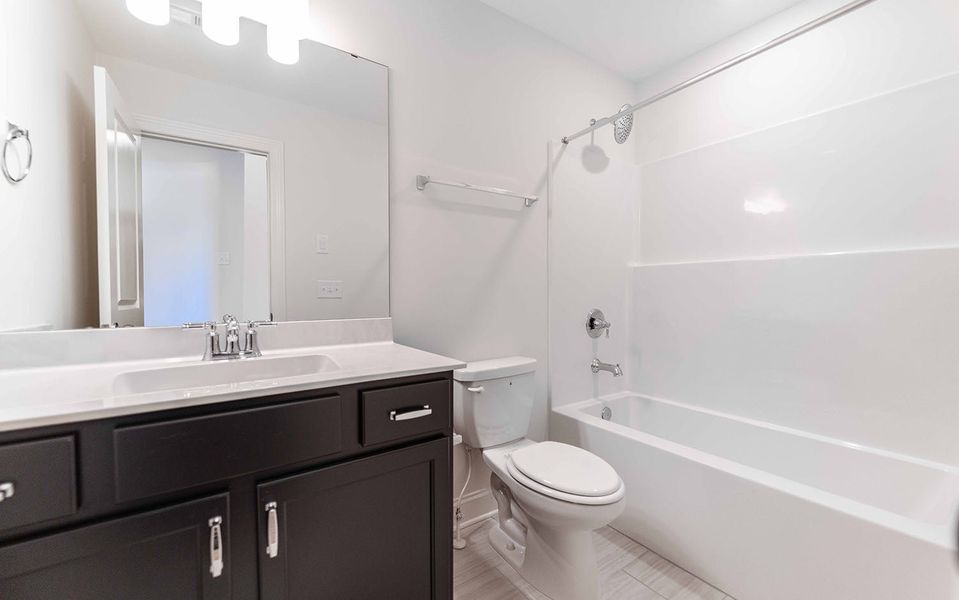 Furnished interior view inside a new home in Aden Woods, Fairview (Image 14).