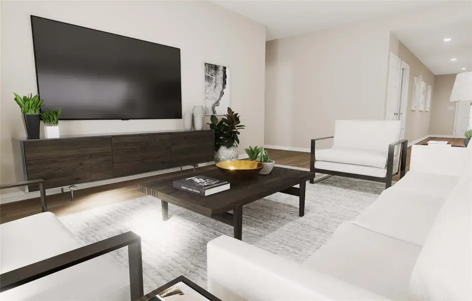 Living room featuring recessed lighting, wood finished floors, and baseboards Living room featuring recessed lighting, wood finished floors, and baseboards