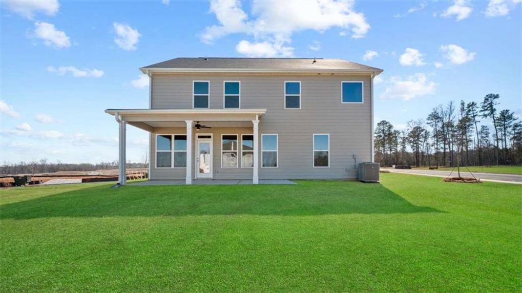 Exterior details and patio area of a home in Evergreen Crossing, Locust Grove (Image 3).