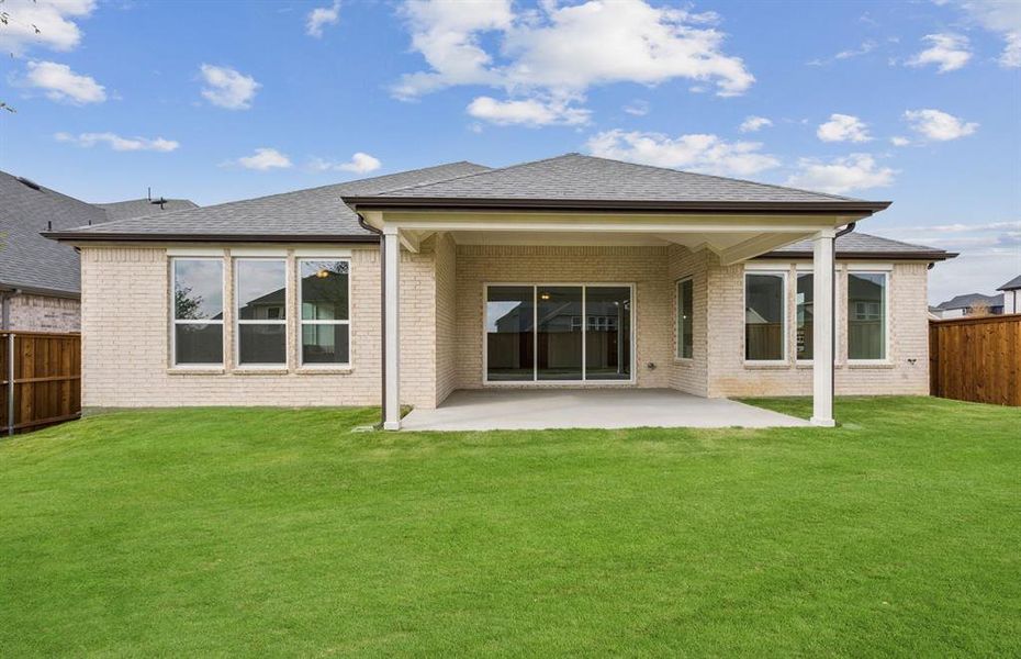 Large covered patio offers ample space for entertaining or relaxing Large covered patio offers ample space for entertaining or relaxing