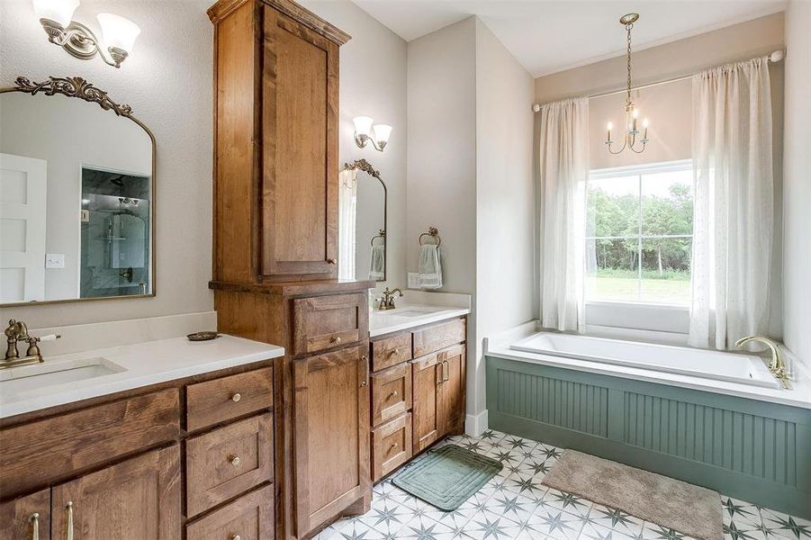 Beautiful primary bath with dual sinks & garden tub. Beautiful primary bath with dual sinks & garden tub.