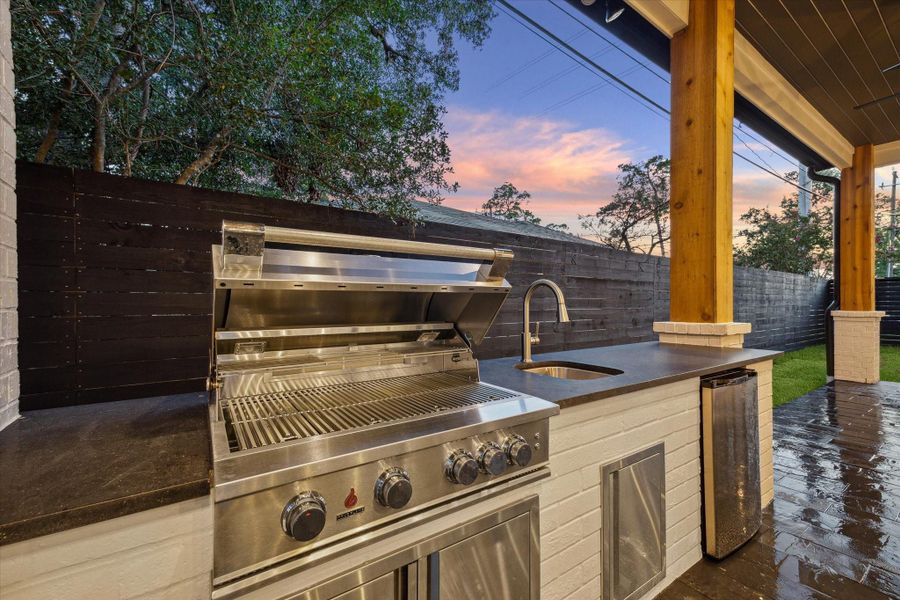 Close up of the fully stocked outdoor kitchen*Picture is of a recently constructed home by the builder.  1519 Candlelight will be similar in quality, but these pictures are not meant to be an exact representation of the new home. Specs of home may change at sole discretion of the seller.