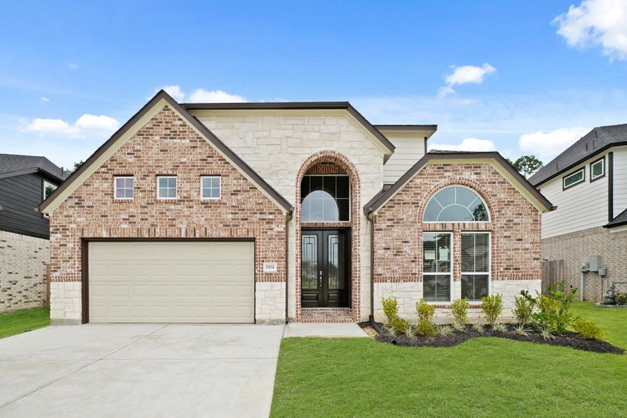 Front exterior of a new home in Barton Creek Ranch, Conroe, TX, highlighting curb appeal (Image 13). Front exterior of a new home in Barton Creek Ranch, Conroe, TX, highlighting curb appeal (Image 13).