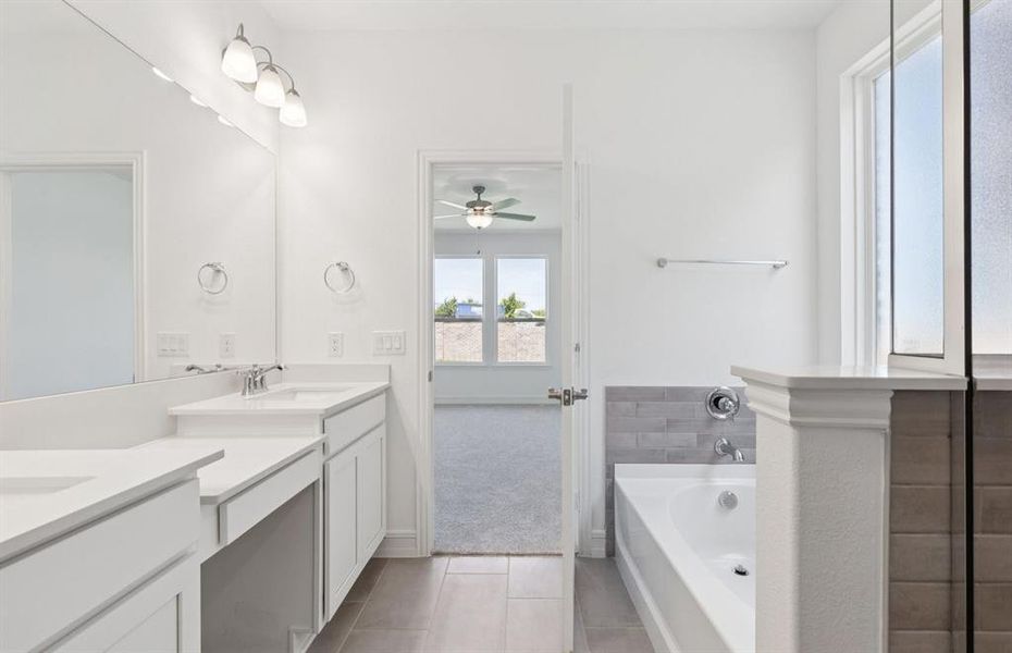 Elegant owner's bathroom with dual vanity *real home pictured Elegant owner's bathroom with dual vanity *real home pictured