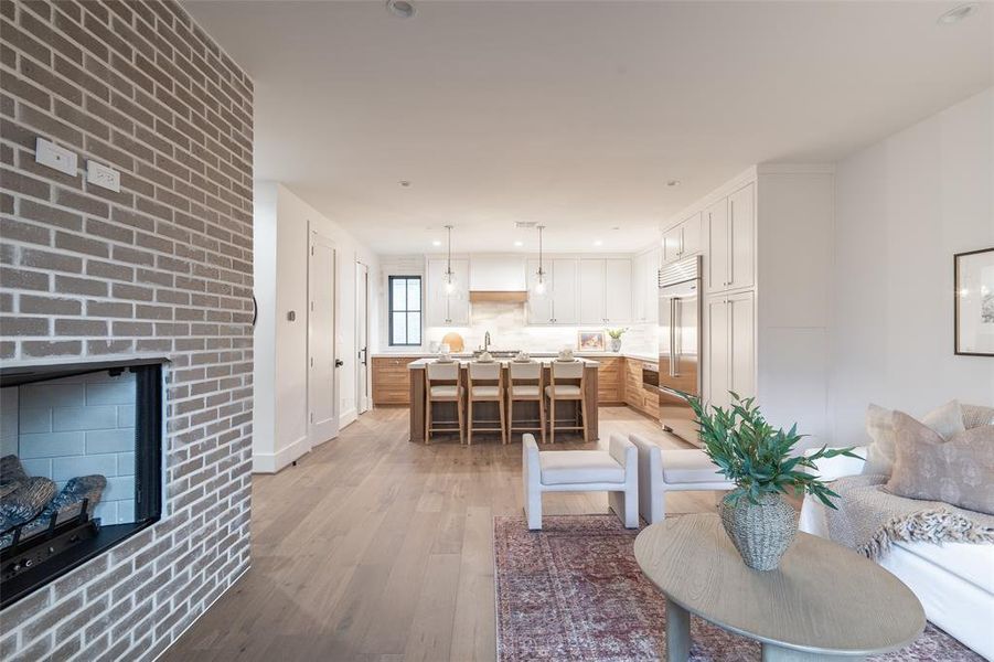 Living room featuring a fireplace and light wood-type flooring