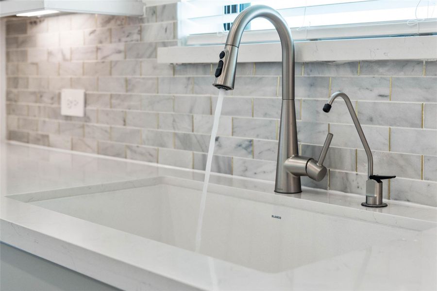 The Moen Sleek stainless steel kitchen faucet offers versatility and contemporary design, complemented by a convenient separate filtered water dispenser faucet. The Moen Sleek stainless steel kitchen faucet offers versatility and contemporary design, complemented by a convenient separate filtered water dispenser faucet.