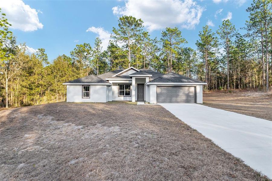 Front exterior of a new home in , Dunnellon, FL, highlighting curb appeal (Image 29).