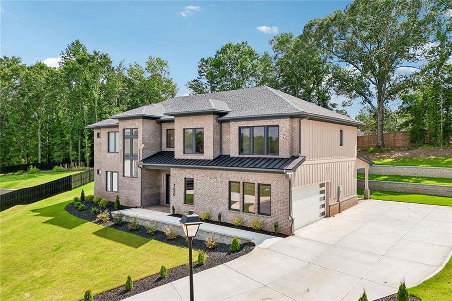 Front exterior of a new home in , Auburn, GA, highlighting curb appeal (Image 37). Front exterior of a new home in , Auburn, GA, highlighting curb appeal (Image 37).