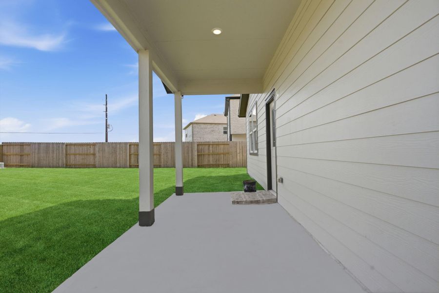 Exterior details and patio area of a home in , Iowa Colony (Image 30).