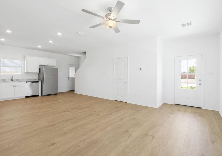 Vinyl flooring throughout the family room and kitchen