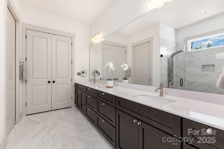 Primary bath with lovely tilework and great counterspace Primary bath with lovely tilework and great counterspace