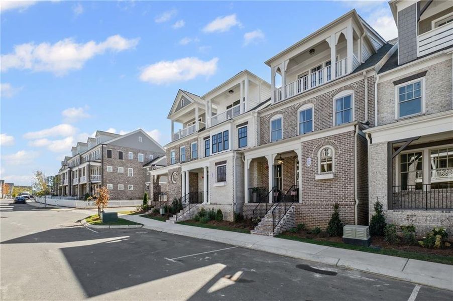 Front exterior of a new home in , Woodstock, GA, highlighting curb appeal (Image 21).