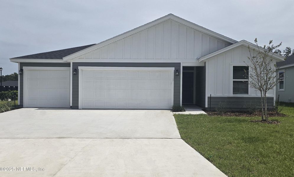 Front exterior of a new home in Azalea Creek, Jacksonville, FL, highlighting curb appeal (Image 16). Front exterior of a new home in Azalea Creek, Jacksonville, FL, highlighting curb appeal (Image 16).