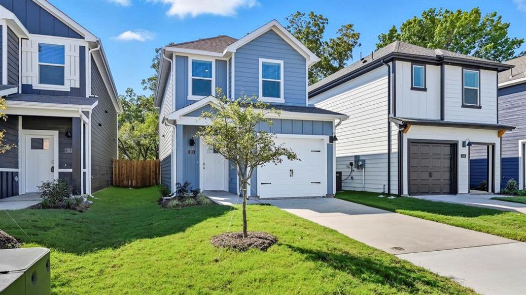 View of front of home featuring board and batten siding, roof with shingles, an attached garage, and concrete driveway View of front of home featuring board and batten siding, roof with shingles, an attached garage, and concrete driveway