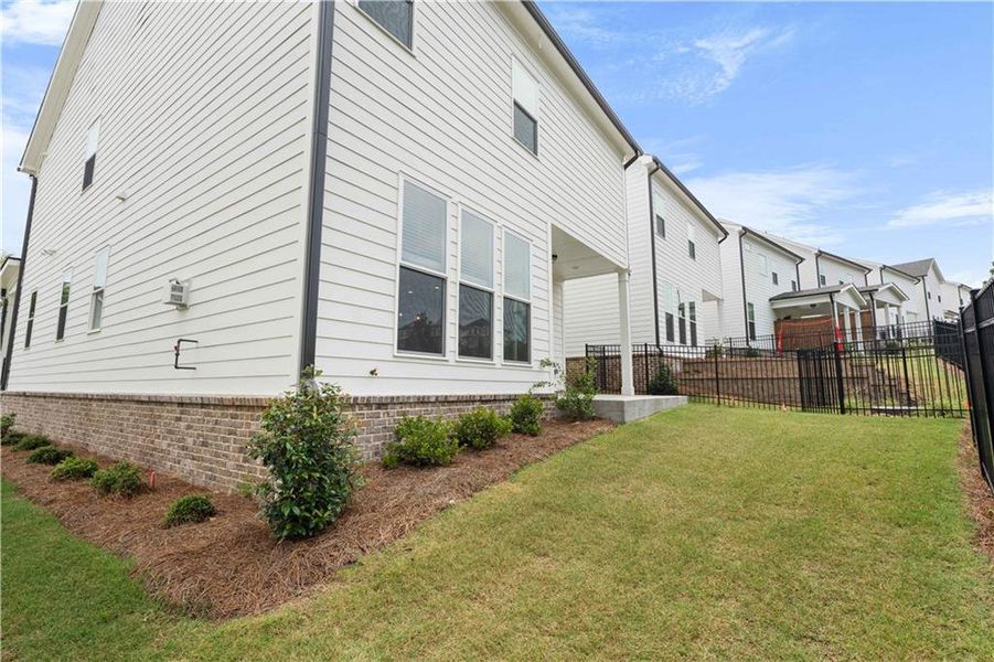 Front exterior of a new home in Palisades Single Family, Cumming, GA, highlighting curb appeal (Image 28).