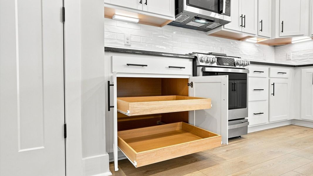 Luxury-inspired kitchen featuring expansive storage space and elegant design elements