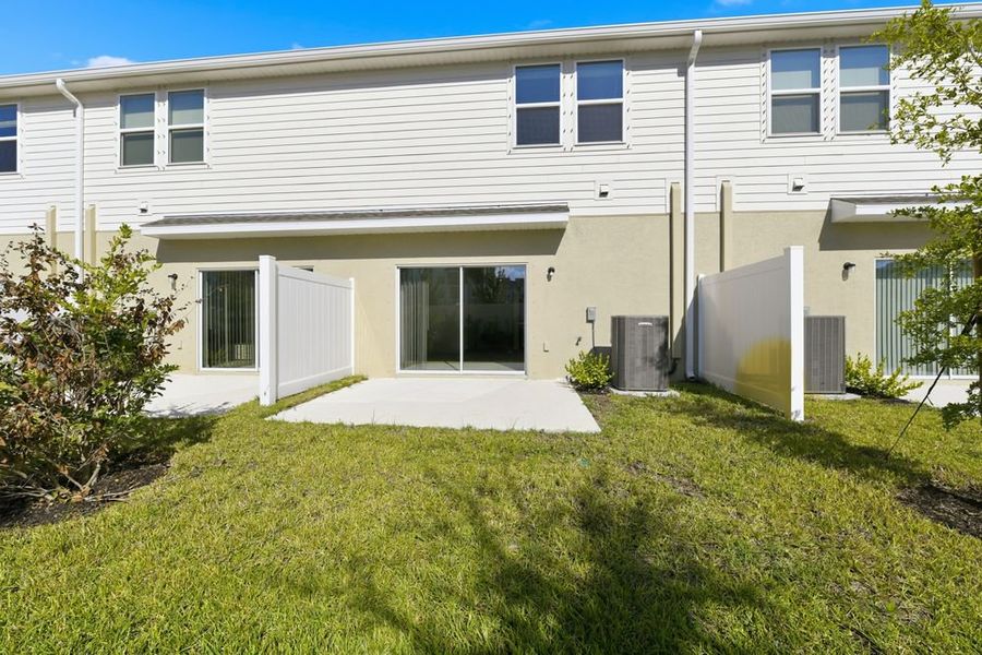 Exterior details and patio area of a home in Vinterra Townhomes, Nokomis (Image 2).