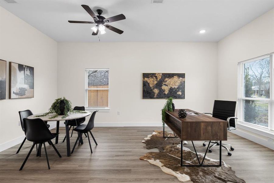 Office space featuring ceiling fan and wood-type flooring