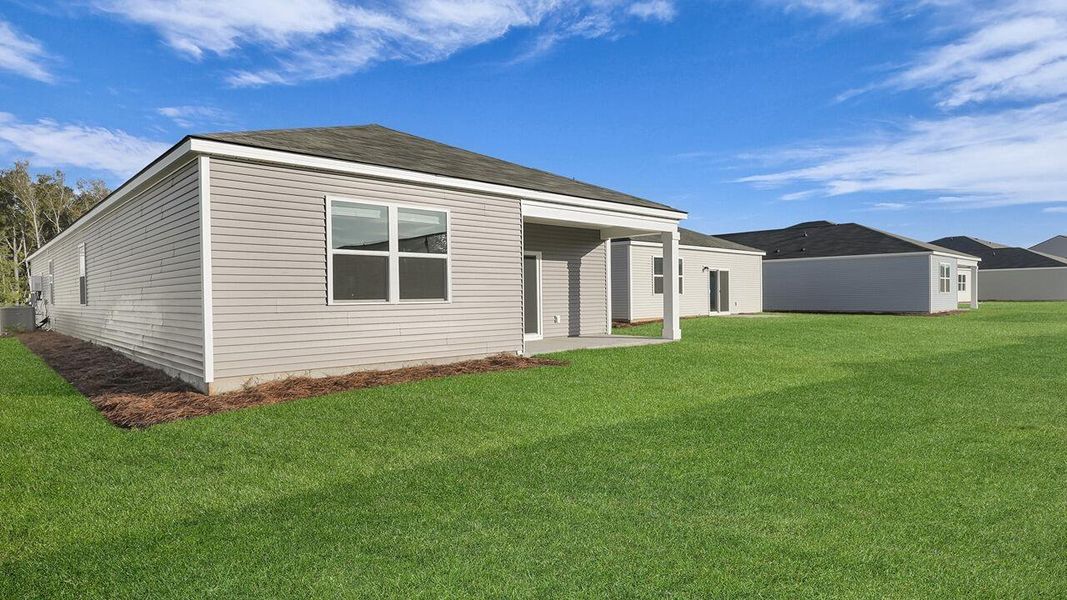 Exterior details and patio area of a home in Pine Hills at Cane Bay, Summerville (Image 2). Exterior details and patio area of a home in Pine Hills at Cane Bay, Summerville (Image 2).