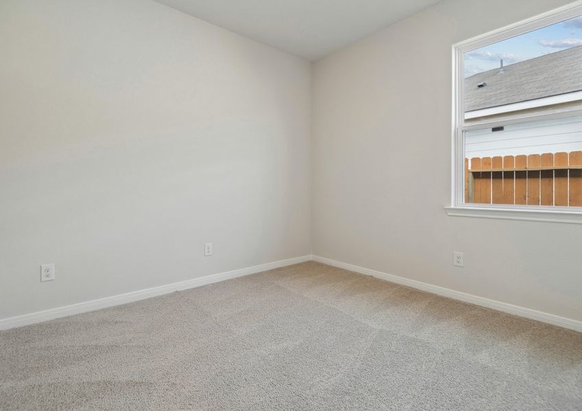 Bedroom with lush carpet