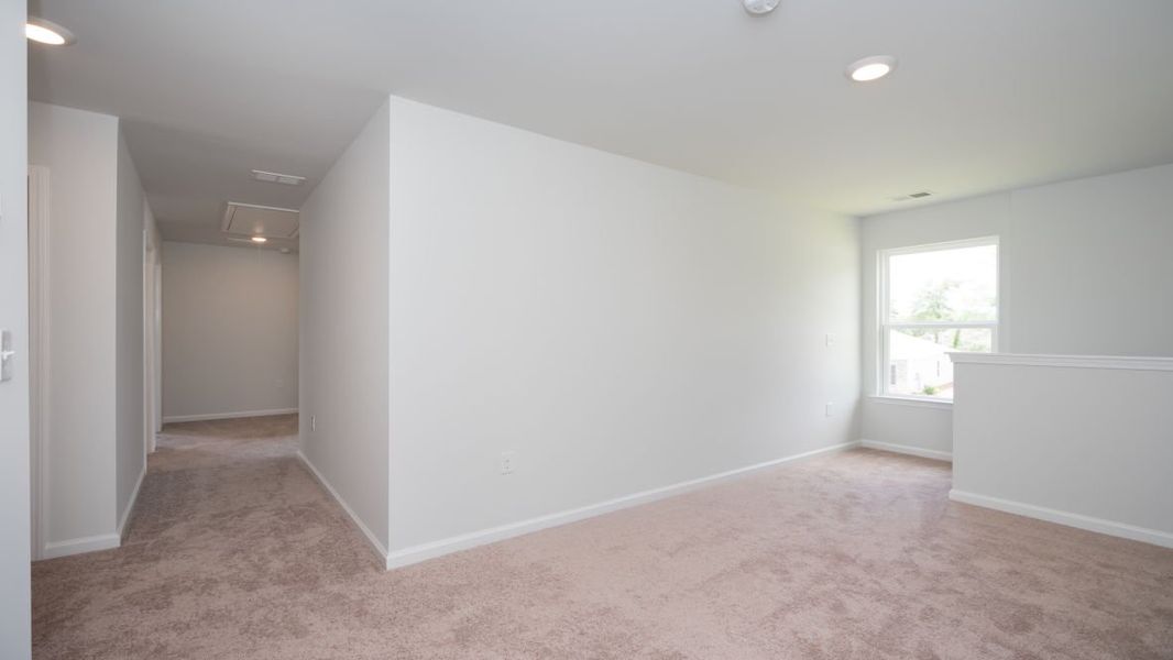 Representative unfurnished interior of a home built from the ROBIE by D.R. Horton in Indigo Preserve, Leland (Image 22).