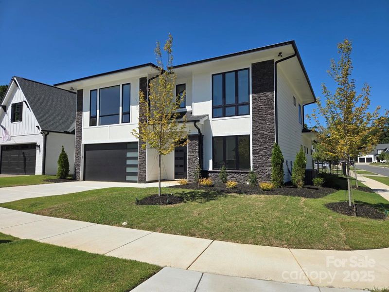 Front exterior of a new home in , Charlotte, NC, highlighting curb appeal (Image 24).