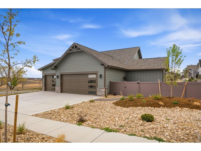 Front exterior of a new home in , Berthoud, CO, highlighting curb appeal (Image 2).