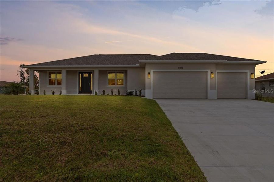 Front exterior of a new home in , Englewood, FL, highlighting curb appeal (Image 19). Front exterior of a new home in , Englewood, FL, highlighting curb appeal (Image 19).