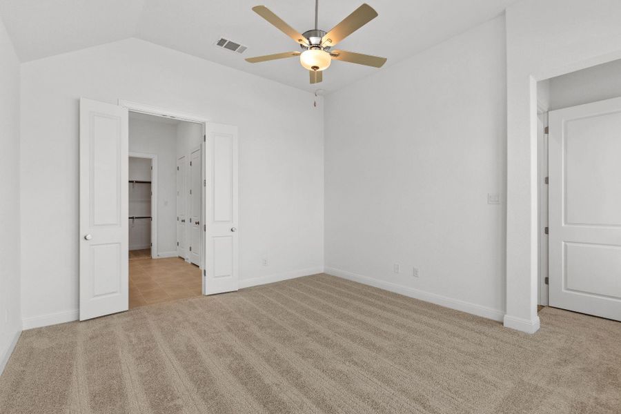 Primary Bedroom with elevated ceiling