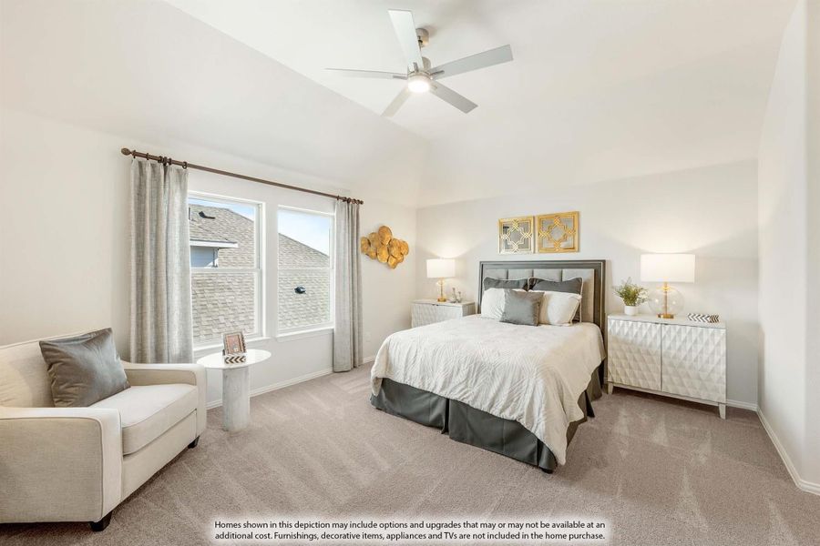 Bedroom with vaulted ceiling, ceiling fan, carpet flooring, and a sitting area near the window