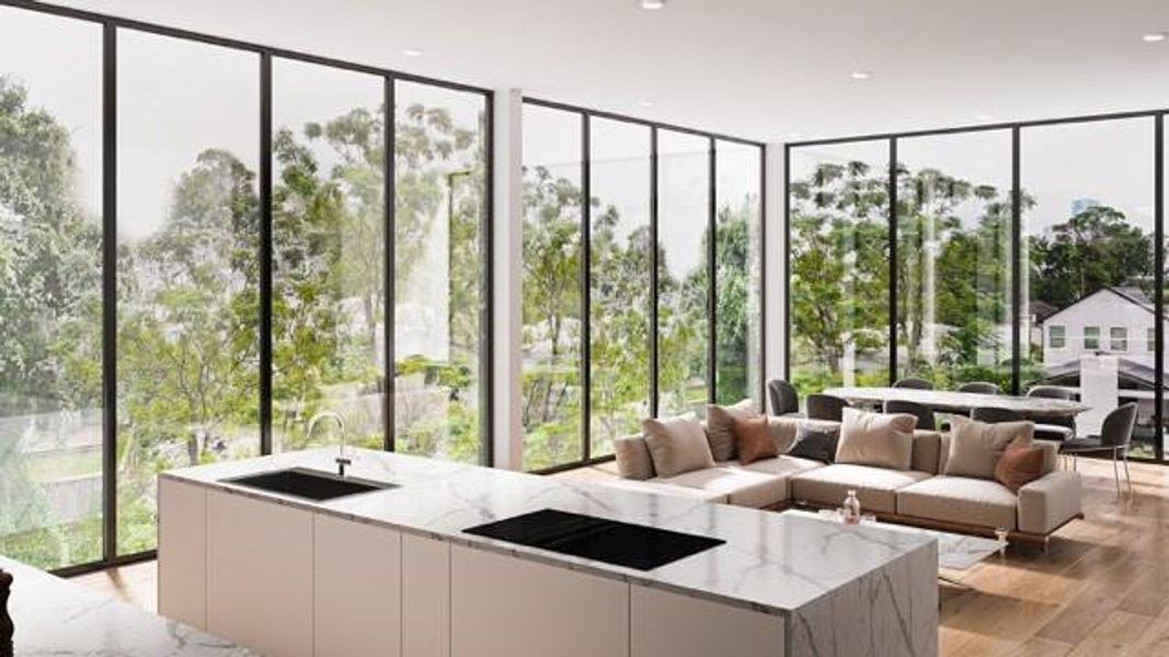 This modern home features an open-concept living area with floor-to-ceiling windows, offering abundant natural light and stunning views of lush greenery. The sleek kitchen island with waterfall quartz countertop and spacious seating area create a perfect space for entertaining and relaxation. Virtually Staged.